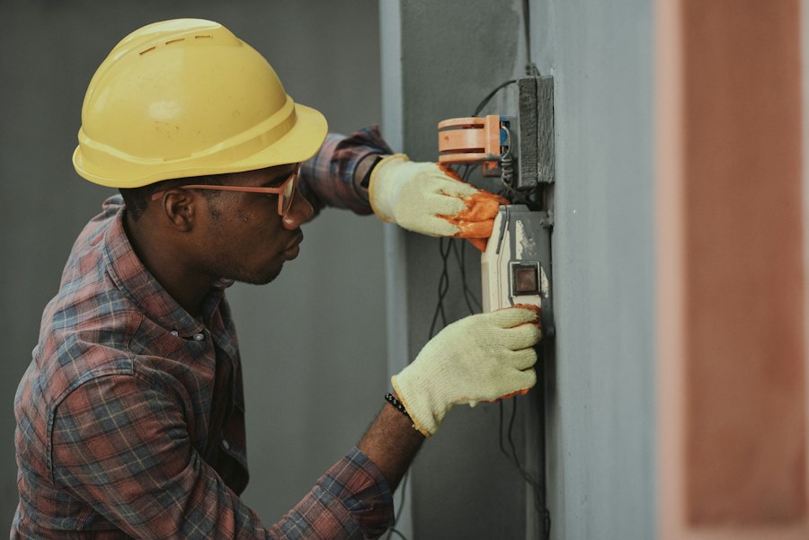 An electrician working on a switchboard